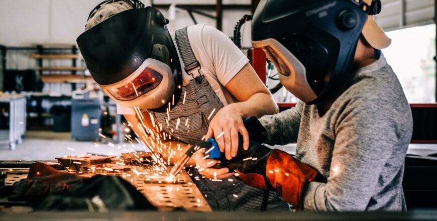 a-female-welder-teaches-a-child-how-to-weld-variou-2024-09-22-02-42-16-utc.jpg